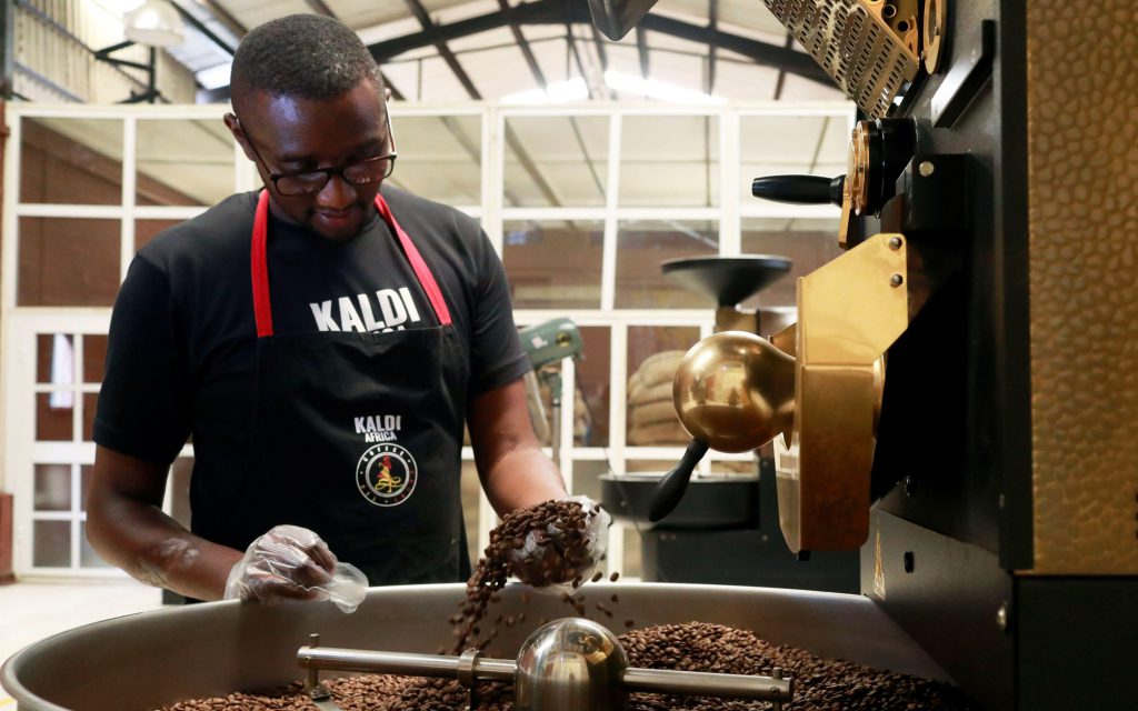 Nigerian roaster at Kaldi Africa roasting coffee, as coffee culture evolves in the country